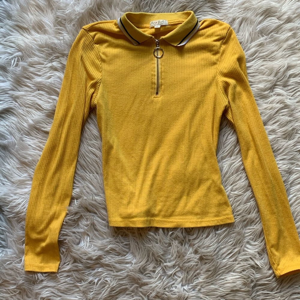 A yellow long sleeve shirt
